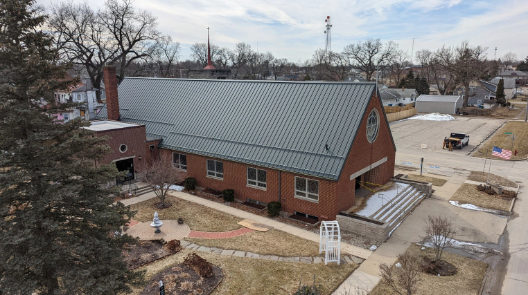 brick church with green roofing bourbon in