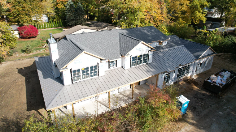 house with a mix of shingles and metal roofing bourbon in