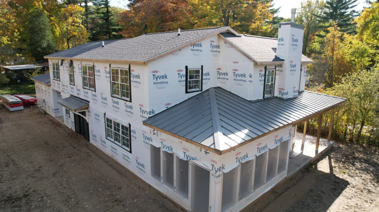 new house with roof shingles and metal roofing bourbon in
