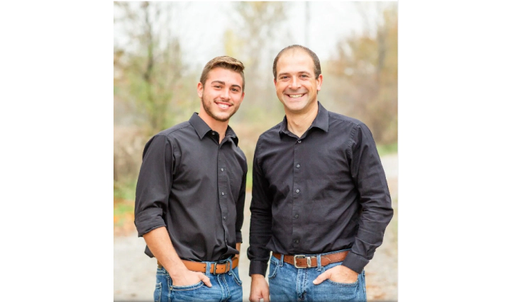 two people wearing black bourbon in1